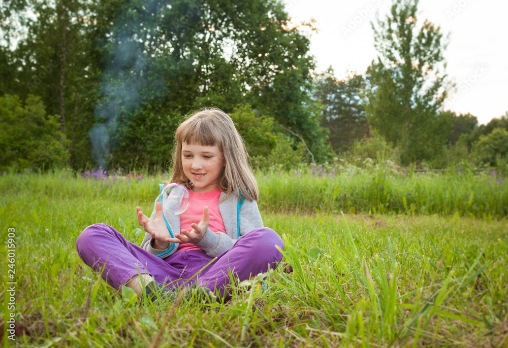Adorable preschooler girl playing with soap bubbles Adorable preschooler girl playing with soap bubbles