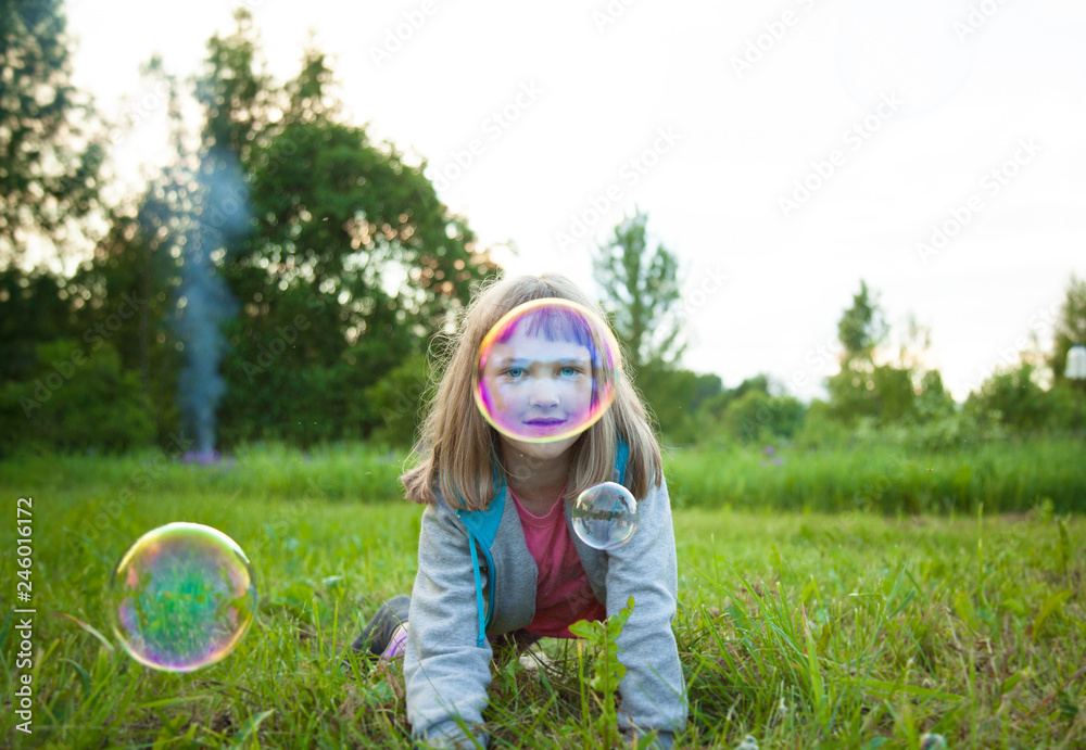 Cute preschooler girl playing with soap bubbles Cute preschooler girl playing with soap bubbles