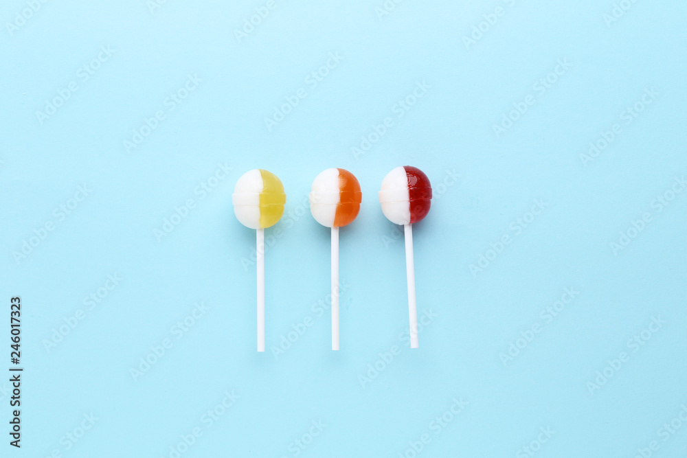 Sweet lollipops on blue background Sweet lollipops on blue background