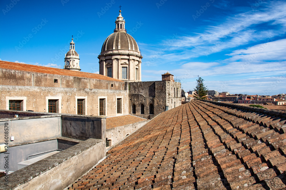 dome and bell tower of the cathedral of Catania with tiles in the foreground