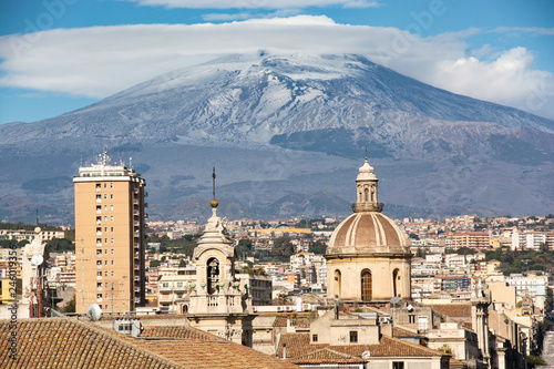 view of the city of Catania with Mount Etna in the background photo