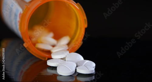 Prescription medication on black background photo