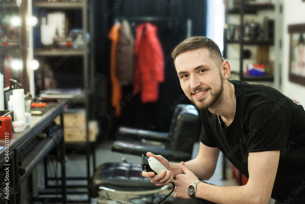young boy Barber waiting for a customer young boy Barber waiting for a customer
