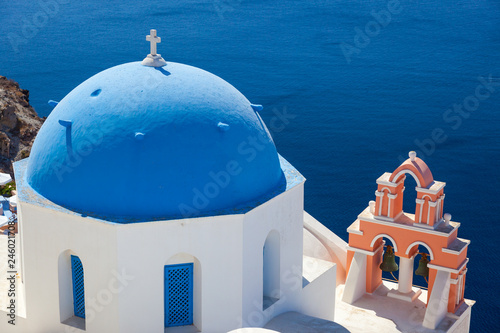 View over caldera and typical blue house at Santorin, Greece