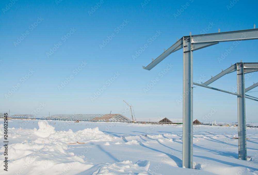 The frame of the building of metal. Prefab building site. The use of a metal frame. Construction for further use on the farm. The frame of the building of metal. Prefab building site. The use of a metal frame. Construction for further use on the farm.