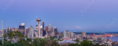 Seattle skyline panorama at summer evening, blue hour with mt. rainier