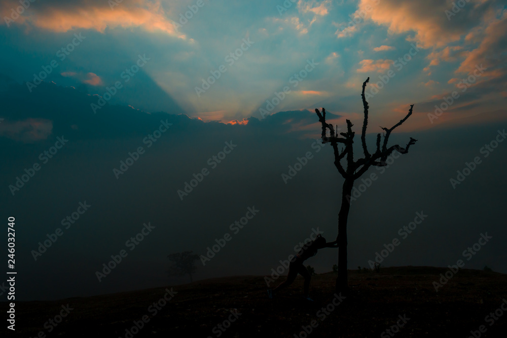 SILHOUETTE OF WOMAN AT SUNRISE
