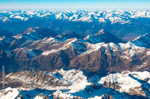Swiss, Italy and Austrian Alps with snowy mountain tops aerial view towards the east during afternoon flight © pszabo