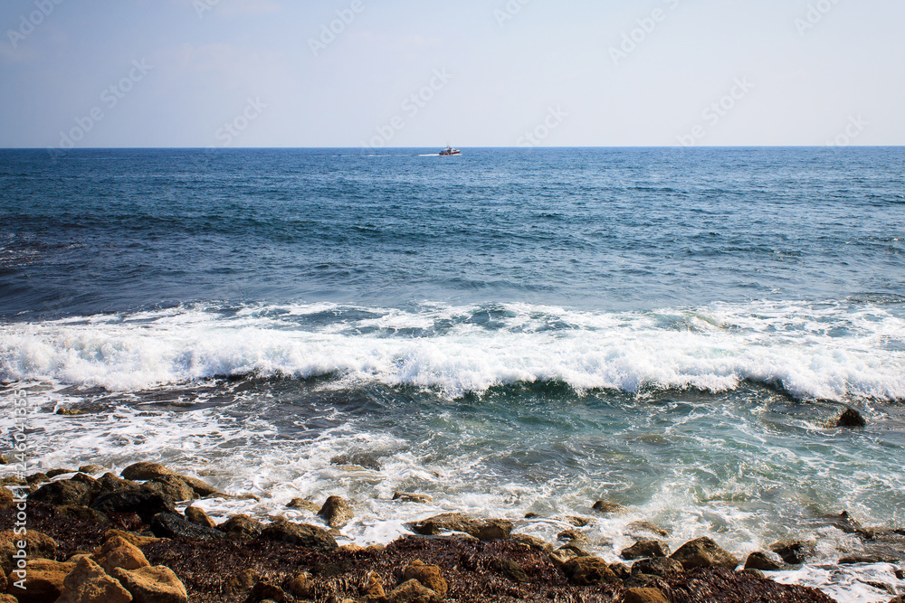 Waves of the Mediterranean Sea crashing on the rocky coast of the island of Cyprus Waves of the Mediterranean Sea crashing on the rocky coast of the island of Cyprus