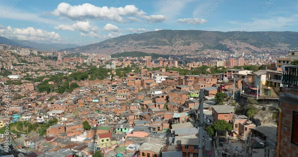 Medellin, Colombia, time lapse of Comuna 13 slums. Once one of the most dangerous neighbourhoods in Colombia Medellin, Colombia, time lapse of Comuna 13 slums. Once one of the most dangerous neighbourhoods in Colombia