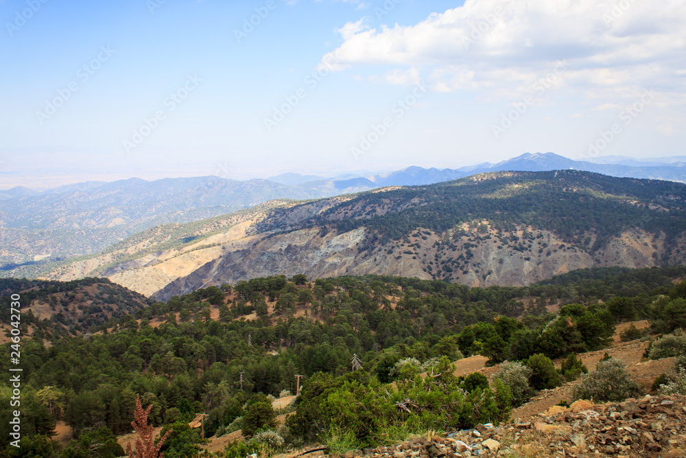 Beautiful scenic view of the panorama of green hills and hills of mountains from the Trodos mountain on the island of Cyprus