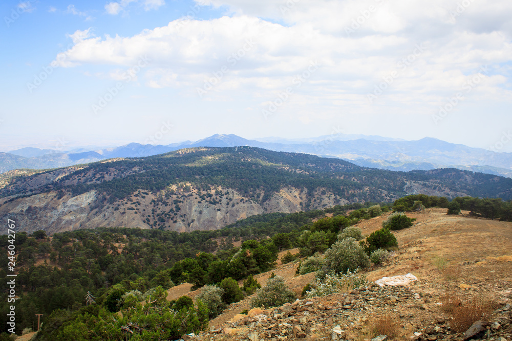 Naklejka premium Beautiful scenic view of the panorama of green hills and hills of mountains from the Trodos mountain on the island of Cyprus