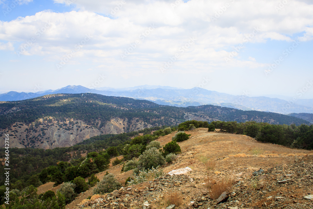 Beautiful scenic view of the panorama of green hills and hills of mountains from the Trodos mountain on the island of Cyprus