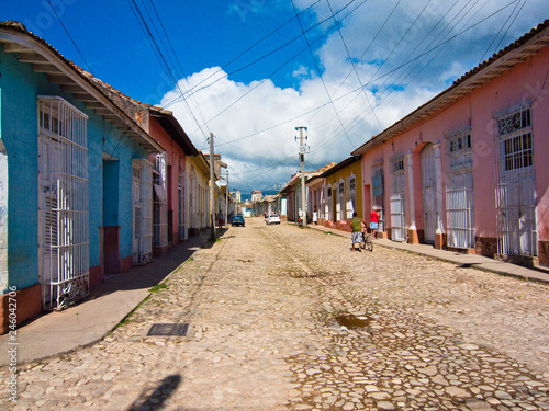 The amazing stone walkways streets of Trinidad at Cuba. Moving in history to another era while being amazed with the idyllic scenery of the old town of Trinidad. Colonial houses, stone streets, wires © abriendomundo