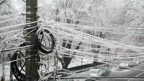 Electricity cables covered in ice after frozen rain phenomenon 