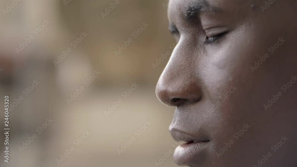 Close up black man closing eyes.African american male person opening his eyes Close up black man closing eyes.African american male person opening his eyes