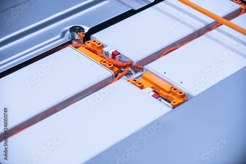 EV car battery pack. Electric car lithium battery pack. Blue toned. Car maintenance.