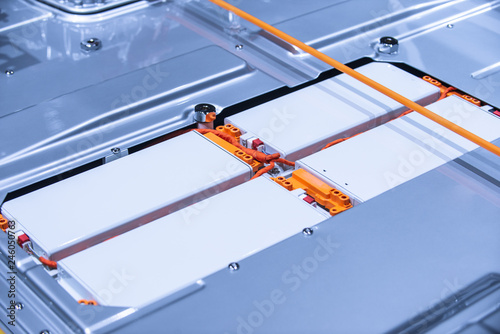 EV car battery pack. Electric car lithium battery pack. Blue toned. Car maintenance.