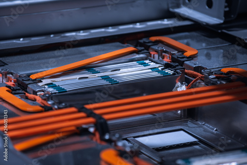 EV car battery pack. Electric car lithium battery pack. Blue toned. Car maintenance.