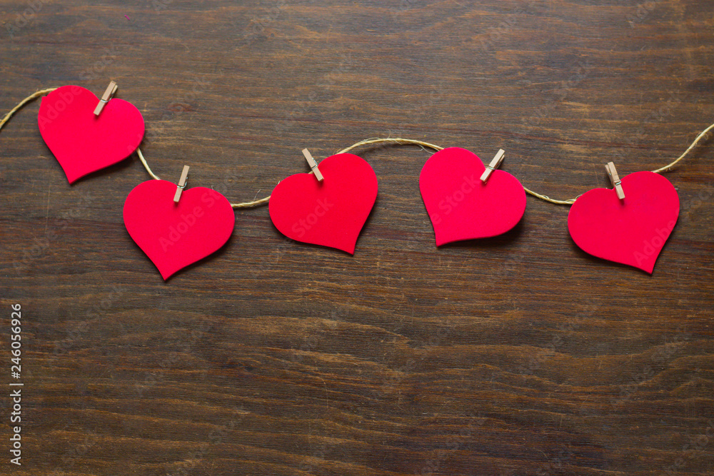 five hearts attached to a rustic thread five hearts attached to a rustic thread