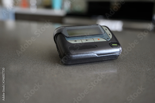 Artistic View of Doctor's Pager on Nursing Desk photo