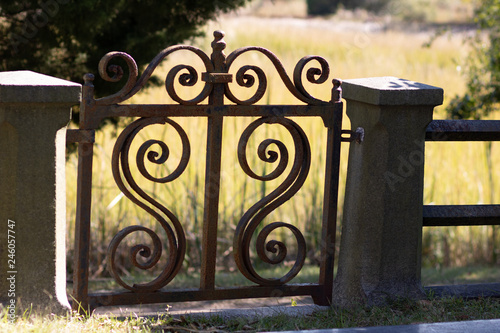 rusty iron scroll gate