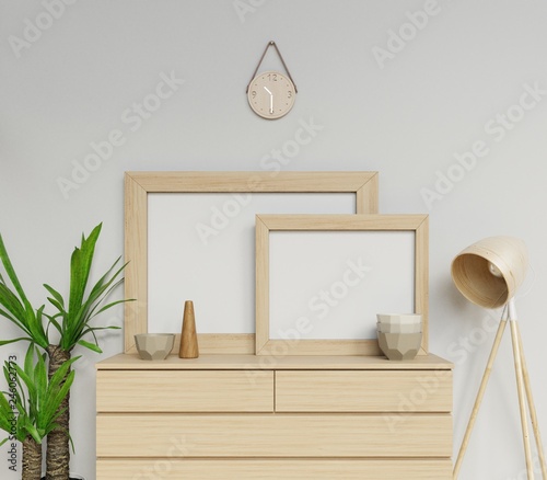 3d render of scandinavian house interior two a1 and a2 size empty poster mock up with wooden frame sitting horizontally on modern drawer perfect for portfolio in front camera view