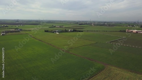 aerial shot over a farm in the countryside photo