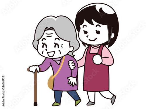 高齢女性に歩行介助を行う女性介護士