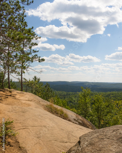 Rock Lookout in Algonquin Park with blue cloud filled sky