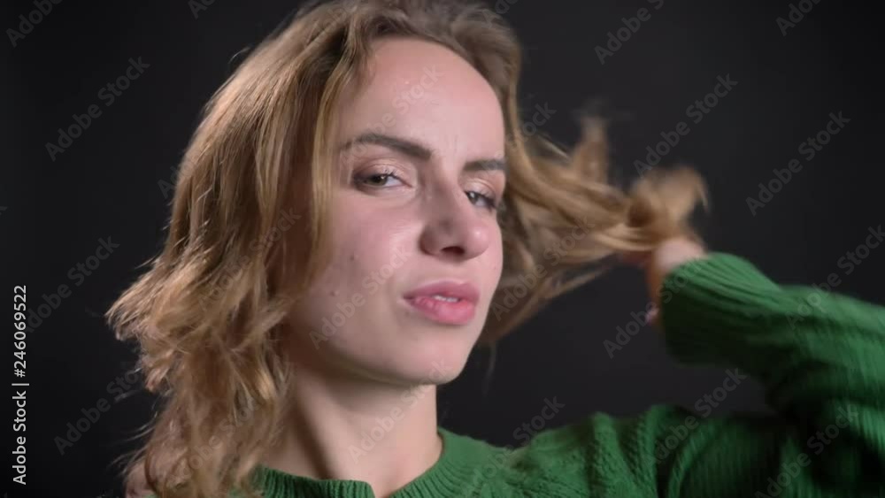 Closeup portrait of adult caucasian female looking at camera smiling and posing Closeup portrait of adult caucasian female looking at camera smiling and posing