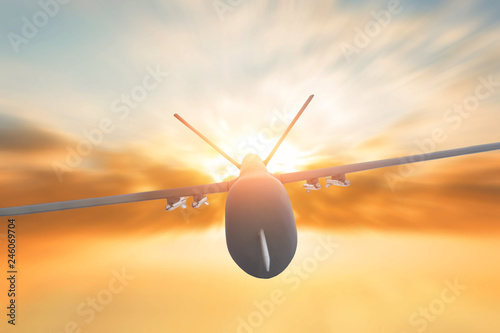 Military drone flight motion blur on sunset background. Close up view.
