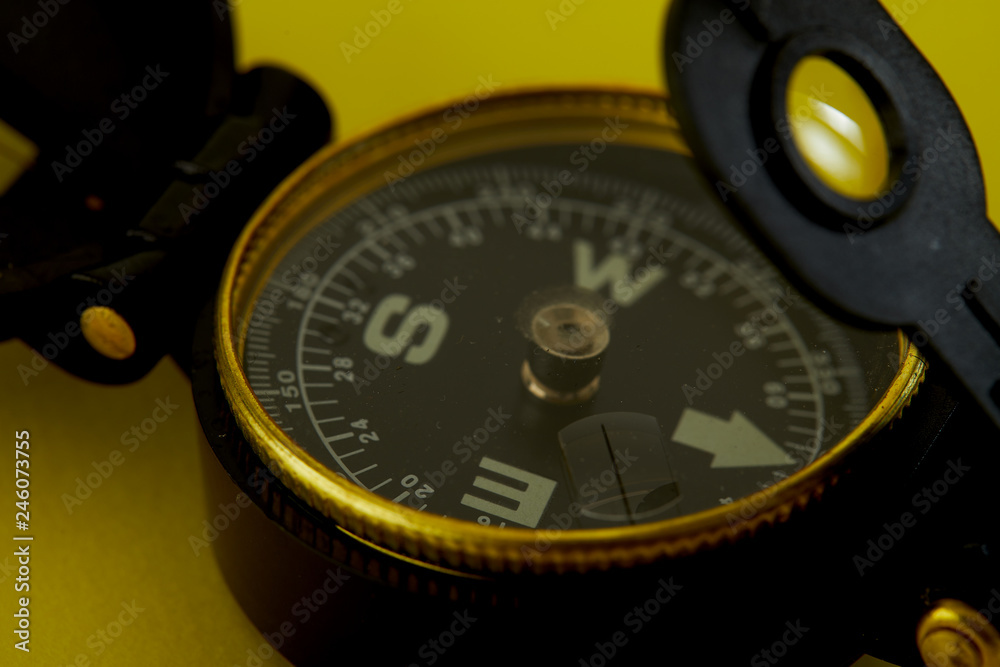 Minimal Compass on bright yellow background Minimal Compass on bright yellow background