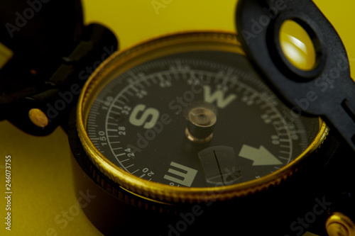Minimal Compass on bright yellow background