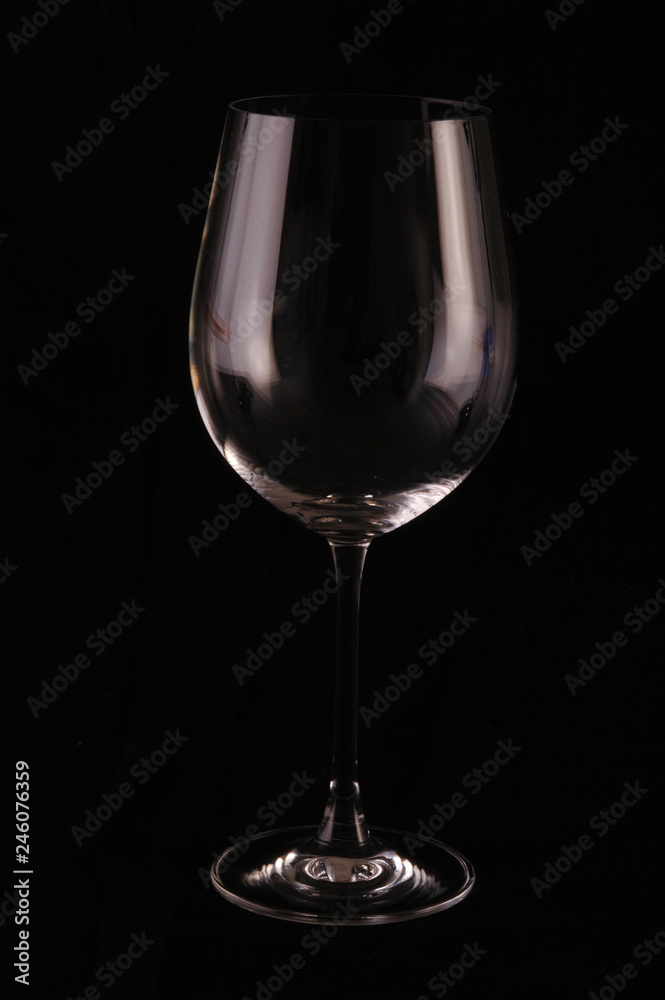 Glass cup on black background