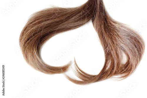 A strand of light brown hair in the shape of a heart close up, isolated on white background