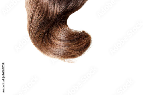 A strand of light brown hair close up, isolated on white background