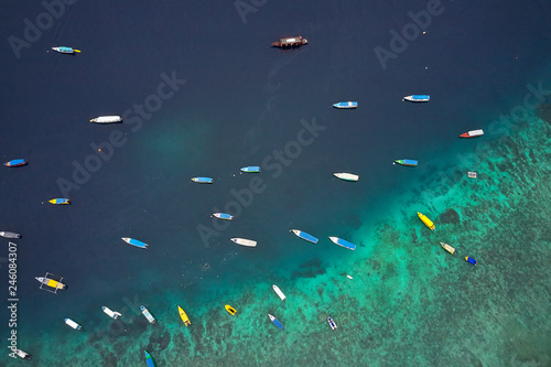 Top view at fishing boats in tropical sea in Indonesia