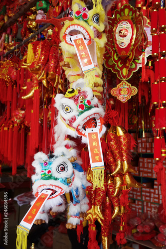 chinese traditional dancing lion hanging for New Year,calligraphy translation:good bless for money