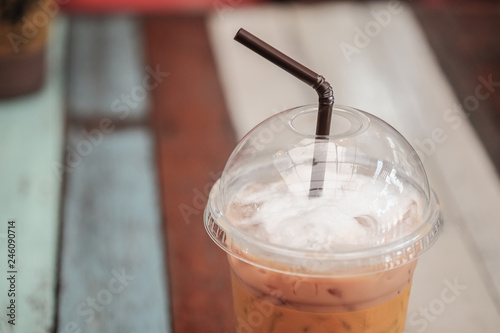 Cold milk tea in plastic glasses photo