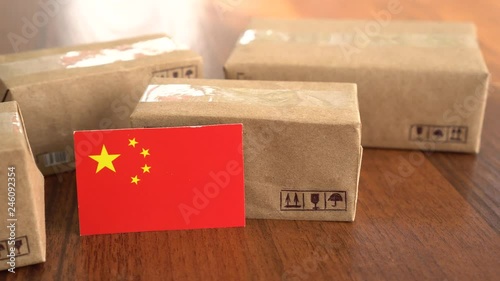 Package box with a flag of China. Online shopping. International E-commerce photo