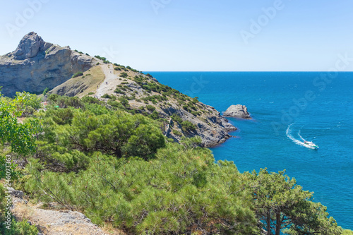 Calm turquoise azure sea in the Blue Bay. Beautiful scenery on the coast of Cape Kapchik in the Crimea