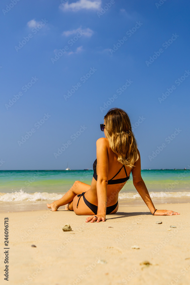 Woman enjoying her holidays on the beach Woman enjoying her holidays on the beach