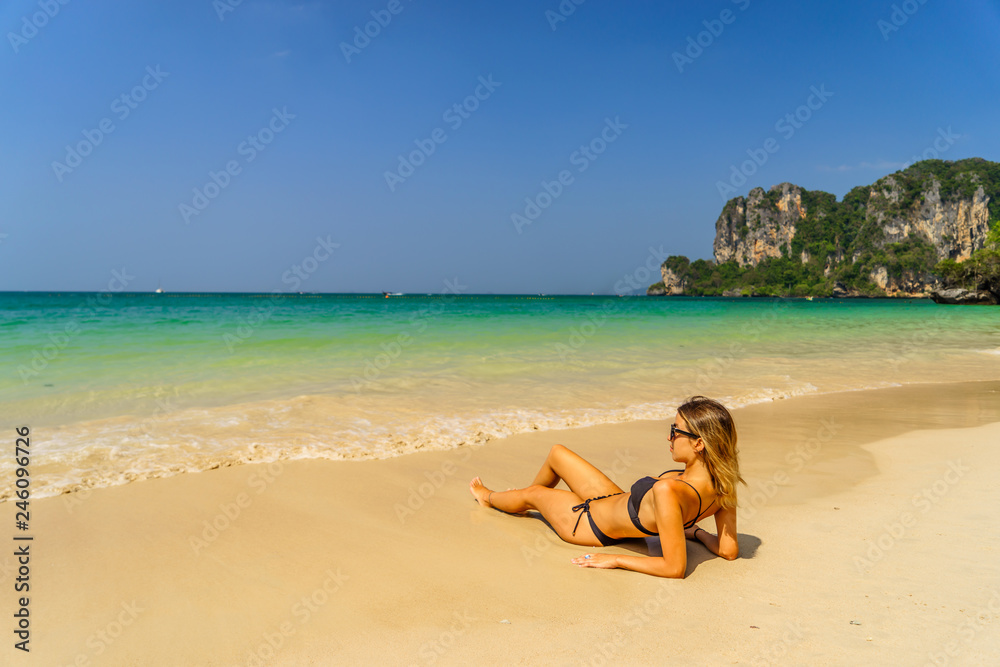 Woman enjoying her holidays on the beach