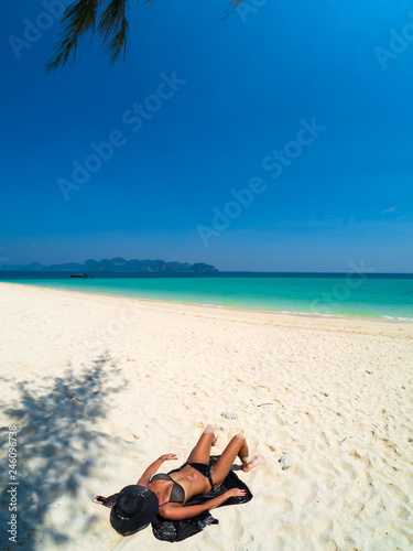 Woman enjoying her holidays on the beach