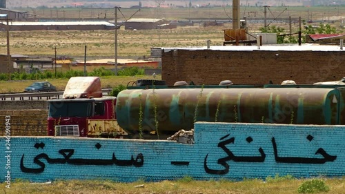 Busy traffic in the background of an aged looking LPG storage facility in Azerbaijan.