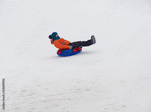 people have fun riding the snow slides on the tubing.