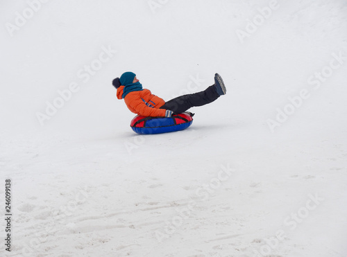 people have fun riding the snow slides on the tubing.