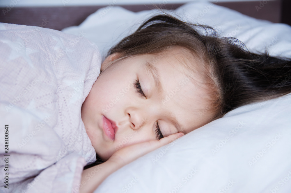 little girls sleeping lying on bed. sleep schedule in domestic lifestyle. cute baby child little girls sleeping lying on bed. sleep schedule in domestic lifestyle. cute baby child