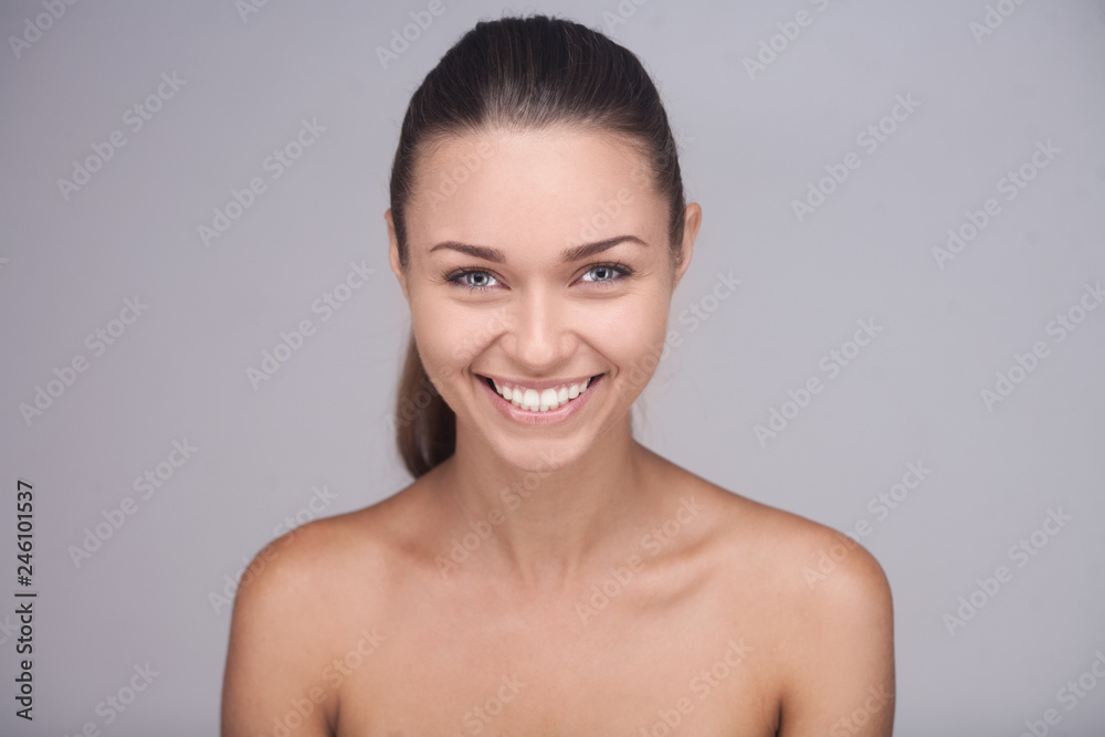 brunette woman with glad smile showing her perfect teeth posing brunette woman with glad smile showing her perfect teeth posing